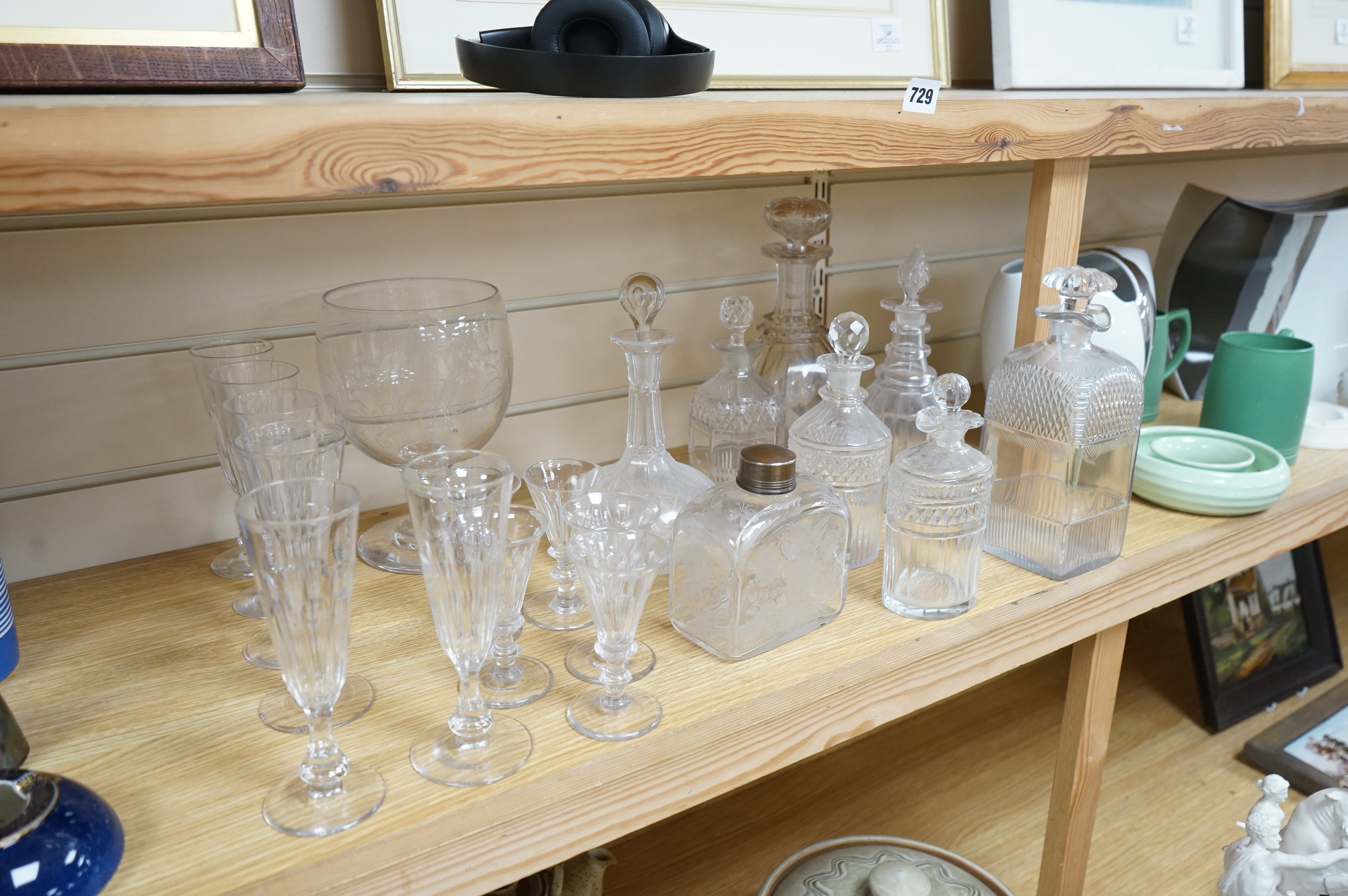 A collection of assorted drinking glassware including sets of decanters and a large etched glass goblet, largest 27cm high